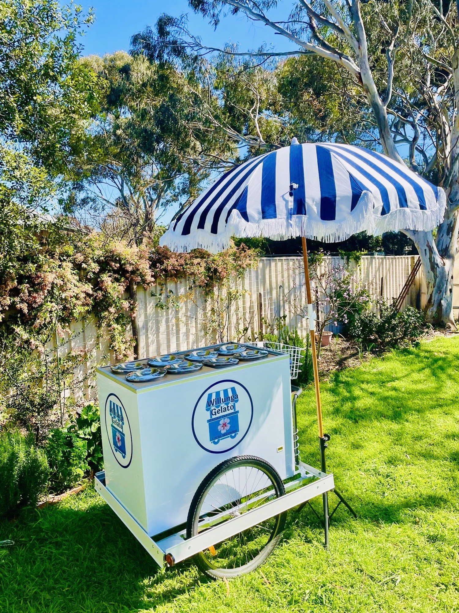 Sweet Life gelato cart with blue and white umbrella