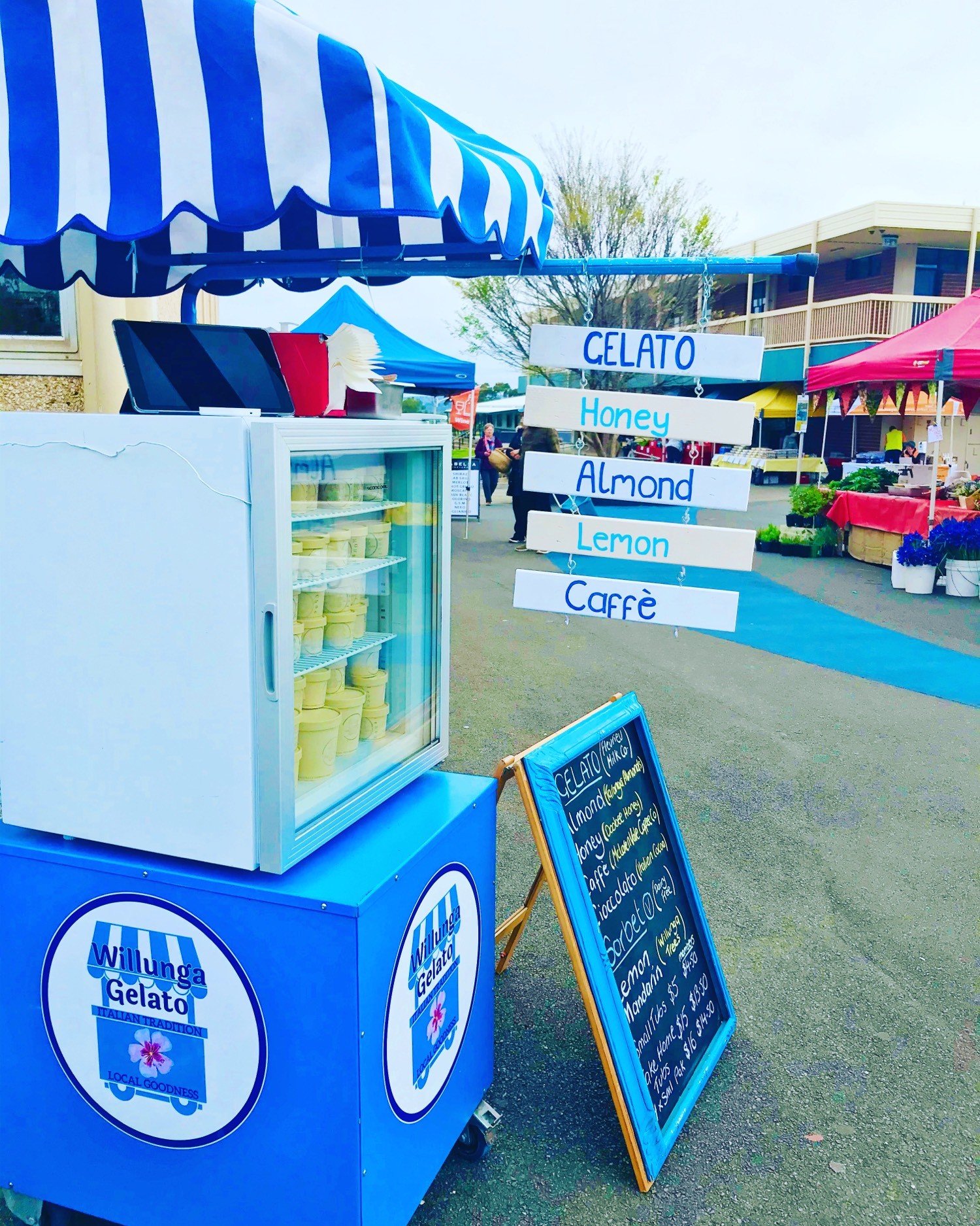 Gelato cart at market with flavour signs